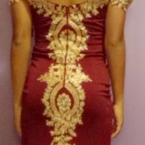 Burgundy and gold prom dress with diamonds in a medium